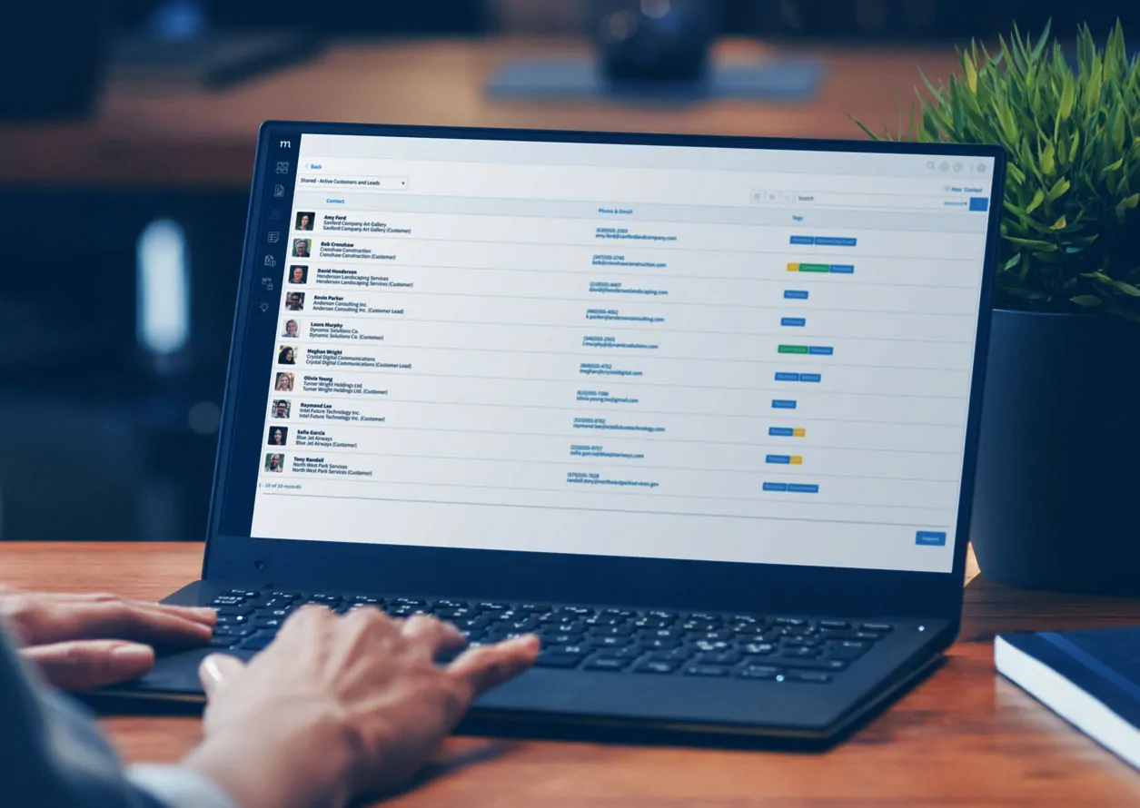 Computer laptop showing a list of contacts in Method CRM.